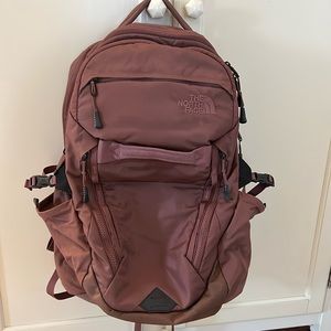 Limited addition North face backpack. This dark pink bag has so many pockets!
